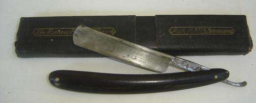 A boxed German made cut throat razor for auction