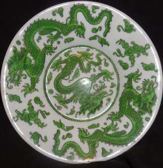 A vintage COALPORT designed shallow bowl with  green dragons design. UNUSUAL