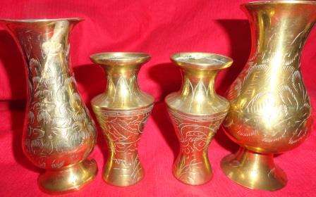 FOUR ORNATE  BRASS VASES...
