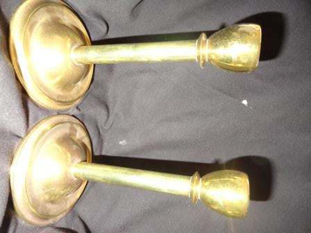 A pair of heavy brass candlestands
