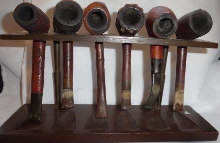 An original  used six pipe collection on stand.