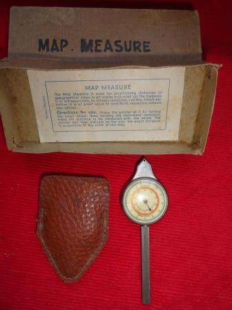 A vintage map measure in its leather case.Original box with instructions for use.