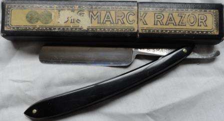 A boxed cut throat razor