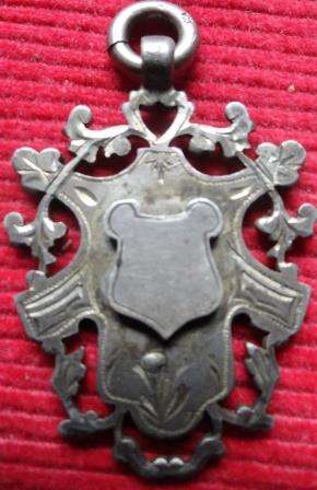 A hall marked silver pendant