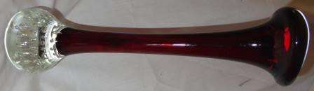 A magnificent blood red thin stemmed Murano (?) vase .