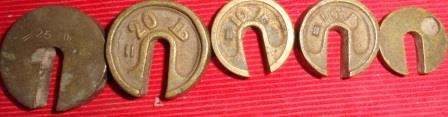 A collection of vintage brass weights