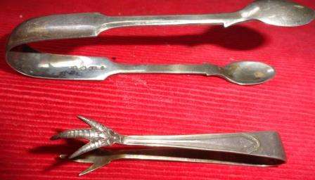 A pair of EPNS sugar /ice tongs