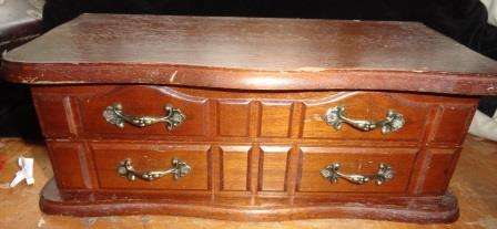 A magnificient wooden jewellery box with mirror etc.