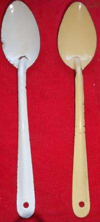 Two large enamel spoons of yester year.