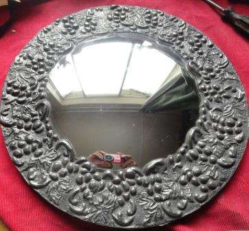 An exceptional large pewter convex mirror