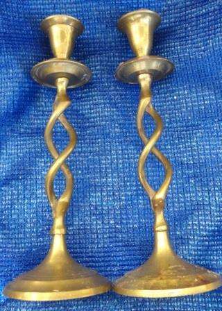 A pair of brass barley twist candle stands