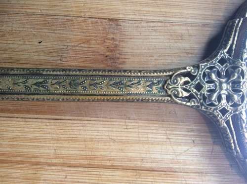 Antique brass hand mirror.