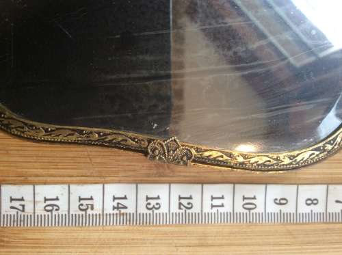 Antique brass hand mirror.
