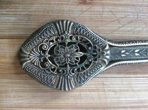 Antique brass hand mirror.
