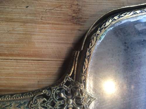 Antique brass hand mirror.