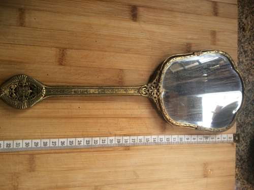 Antique brass hand mirror.