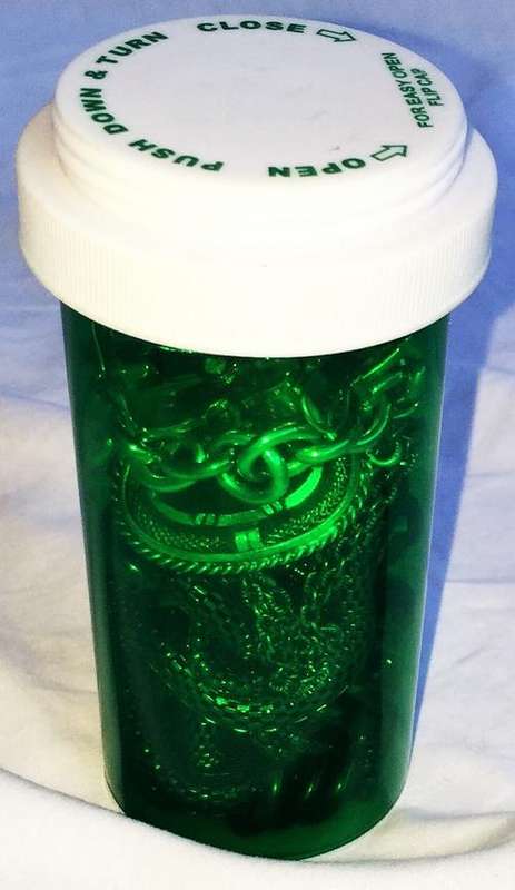 GREEN TUBE FILLED WITH OLD JEWELLERY ! SELLING AS IS !