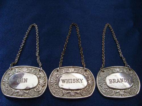 SILVERPLATED IANTHE WINE LABELS..(GIN,WHISKEY,BRANDY)