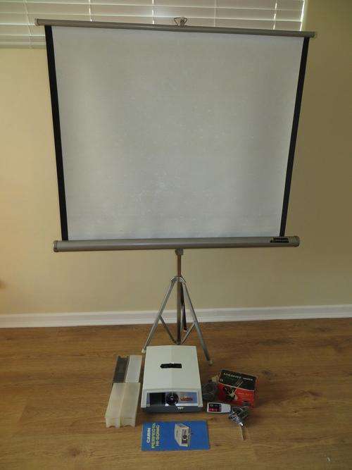CABIN PERFECTA SLIDE PROJECTOR WITH TRIPOD SCREEN AND LOADS OF ACCESSORIES...WORKING CONDITION!!