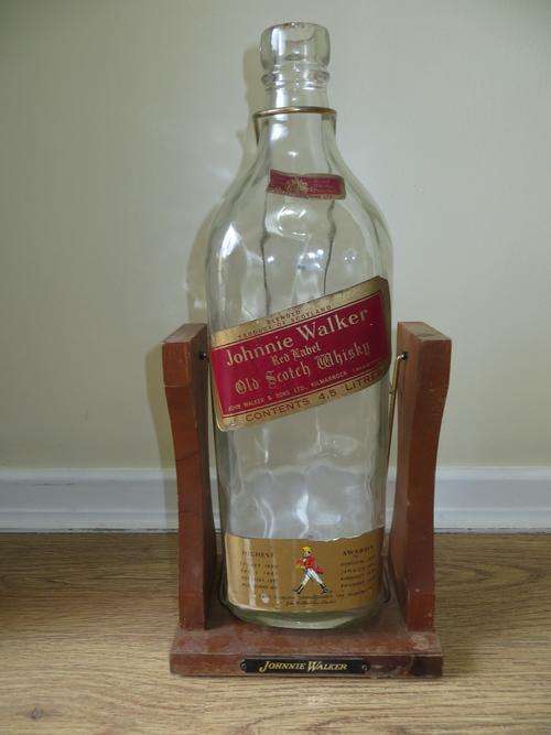 JOHNNIE WALKER RED LABEL OLD SCOTCH WHISKY 4.5LITRES EMPTY BOTTLE ON WOODEN STAND