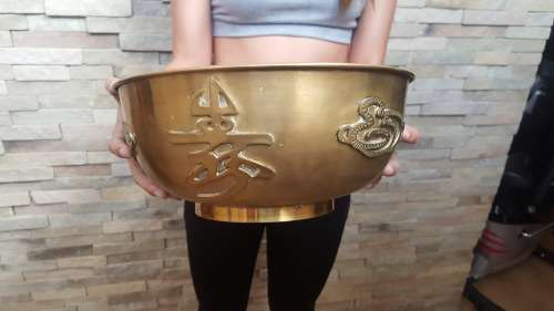 vintage large brass Chinese bowl featuring serpents and calligraphy