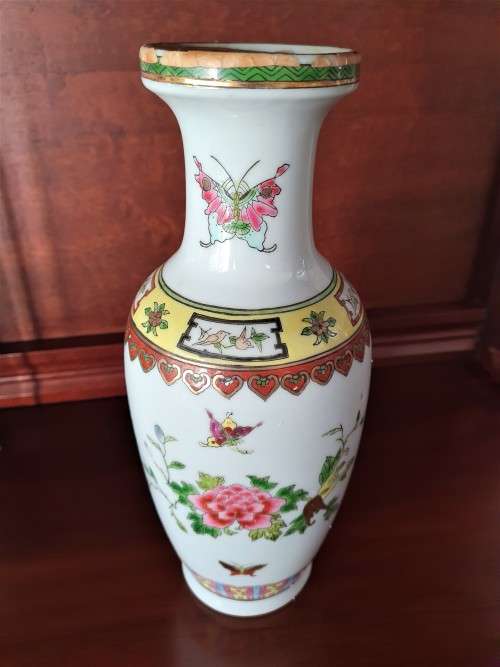 HANDPAINTED CHINESE PORCELAIN VASE, FILLED WITH CONTENTS STILL INSIDE.