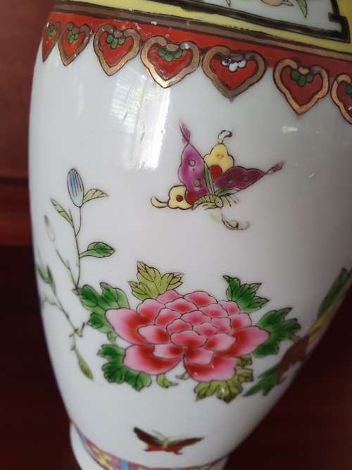 HANDPAINTED CHINESE PORCELAIN VASE, FILLED WITH CONTENTS STILL INSIDE.