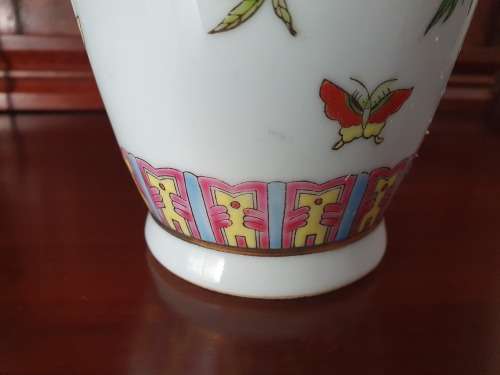 HANDPAINTED CHINESE PORCELAIN VASE, FILLED WITH CONTENTS STILL INSIDE.