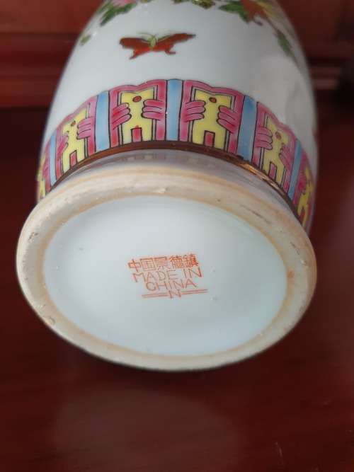 HANDPAINTED CHINESE PORCELAIN VASE, FILLED WITH CONTENTS STILL INSIDE.