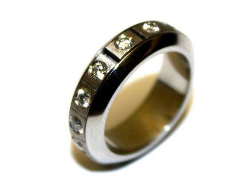 18Ct White Gold Puzzle Twirl Ring with 15 Diamonds - 7.80 Gm 0.90Ct. Value : R 46,595.00