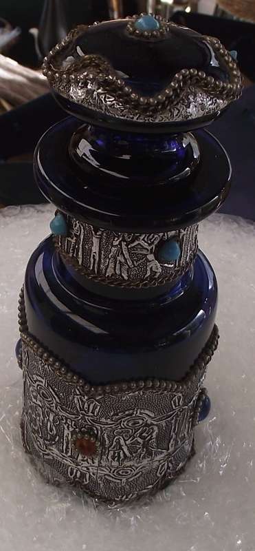 BLUE DECANTER WITH A SLIVER COLOURED  METAL COVER