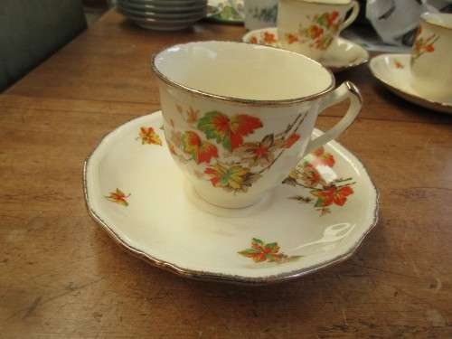 6 ALFRED MEAKIN MARIGOLD CUPS AND SAUCERS