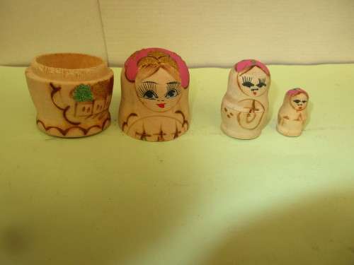 BEAUTIFUL  HANDPAINTED ON WOOD   THREE  DOLLS WHICH FIT INTO EACH OTHER (RUSSIAN DOLL STYLE)