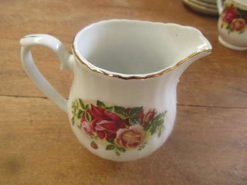 SET OF SEVEN ROYAL CHINA CUPS AND SAUCERS AND A MILK JUG