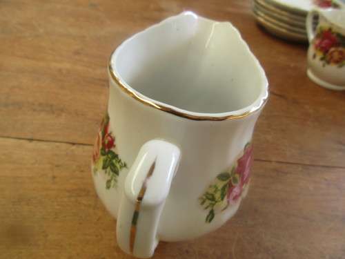 SET OF SEVEN ROYAL CHINA CUPS AND SAUCERS AND A MILK JUG
