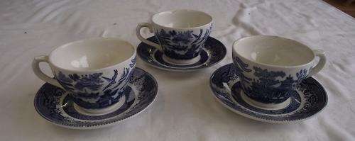 THREE WILLOW PATTERN CUPS AND SAUCERS