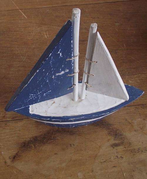 WOODEN MODEL OF A BOAT WITH 2 SAILS