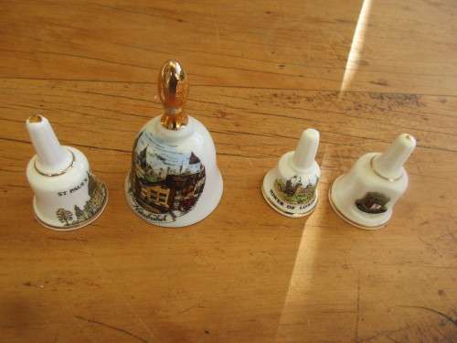 COLLECTION OF FOUR MINIATURE CHINA BELLS ENGLAND
