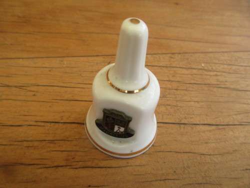 COLLECTION OF FOUR MINIATURE CHINA BELLS ENGLAND