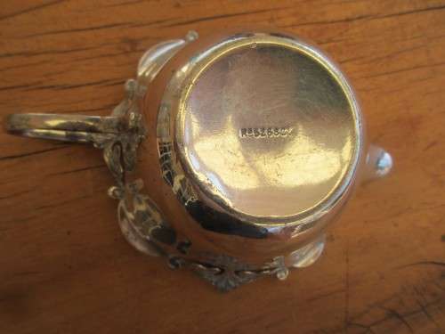 A TWIN HANDLED BOWL ( WALKER AND HALL) AND A CREAMER JUG SILVER PLATED