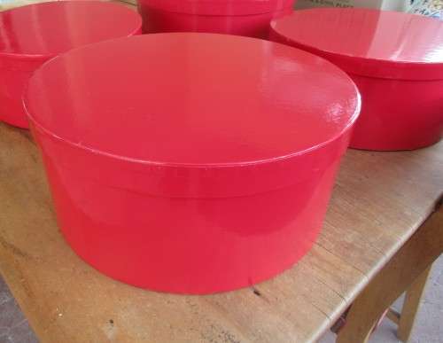 SET OF FOUR FIRE ENGINE RED  CIRCULAR BOXES THEY ALL FIT INTO EACH OTHER