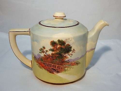 A LARGE ROYAL DOULTON TEA POT ENGLISH COTTAGES