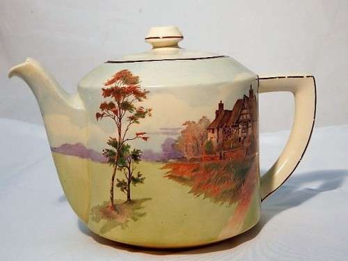 A LARGE ROYAL DOULTON TEA POT ENGLISH COTTAGES