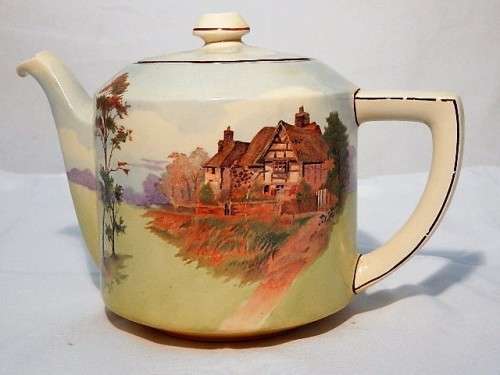A LARGE ROYAL DOULTON TEA POT ENGLISH COTTAGES