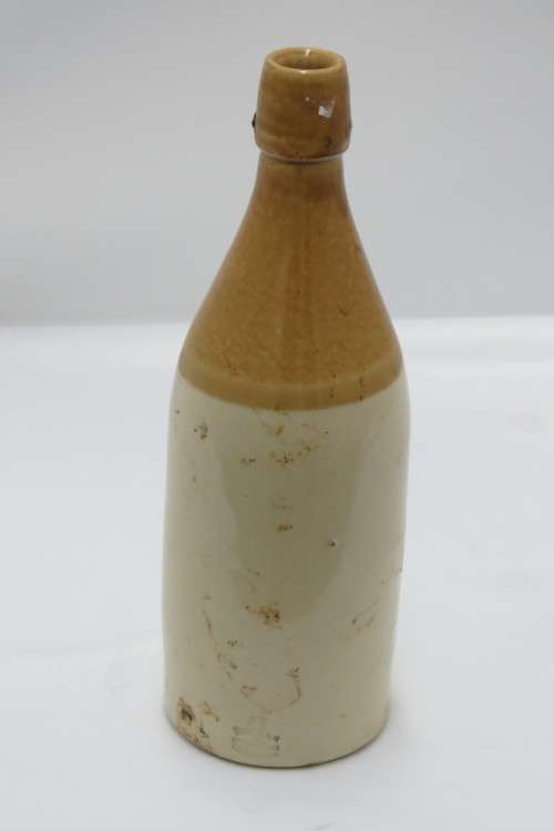 A VINTAGE COLLECTIBLE GINGER BEER BOTTLE J. DELANEY