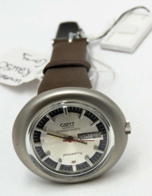 AN UNUSED SUPER AUTOMATIC PICADILLY DAY/DATE WATCH