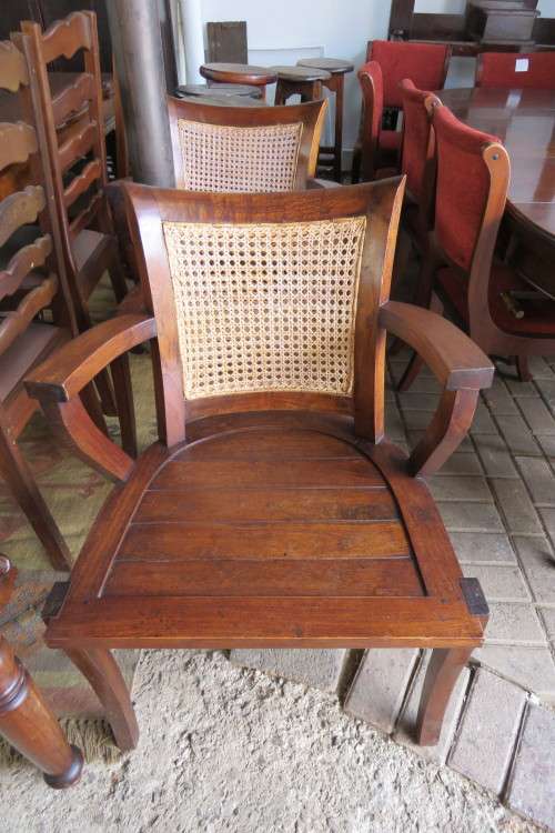 A LOVELY TEAK ARMCHAIR WITH RATTAN BACK