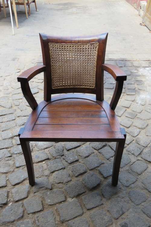 A LOVELY TEAK ARMCHAIR WITH RATTAN BACK