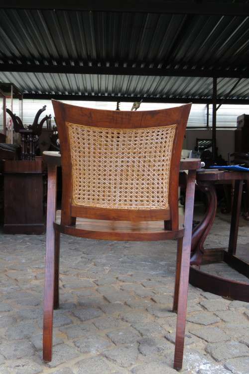 A LOVELY TEAK ARMCHAIR WITH RATTAN BACK