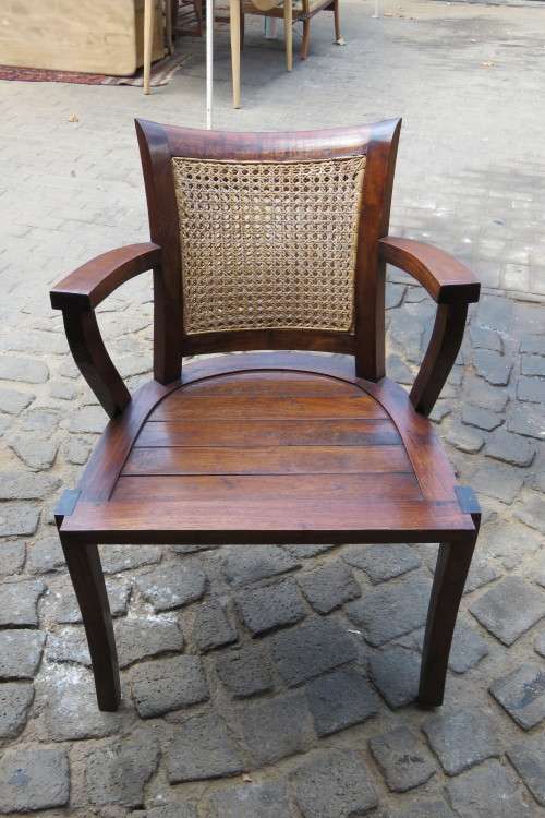 A LOVELY TEAK ARMCHAIR WITH RATTAN BACK